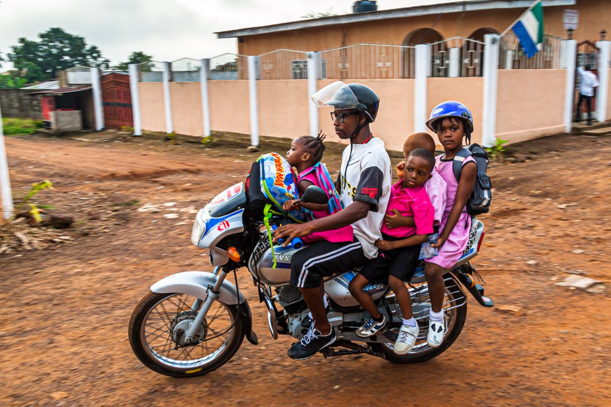 Okada (motorcycletaxi in Sierra Leone) carrying four passengers