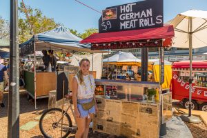 Young German entrepreneur in Australia selling Hot German Meat Rolls