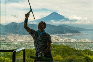 Window Cleaner of Nippondaira Hotel, Shizuoka, Japan with view on Mount Fuji