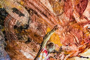 Native Guide explaining Aborigine Rock Art in Long Tom Dreaming, Gunbalanya, Australia